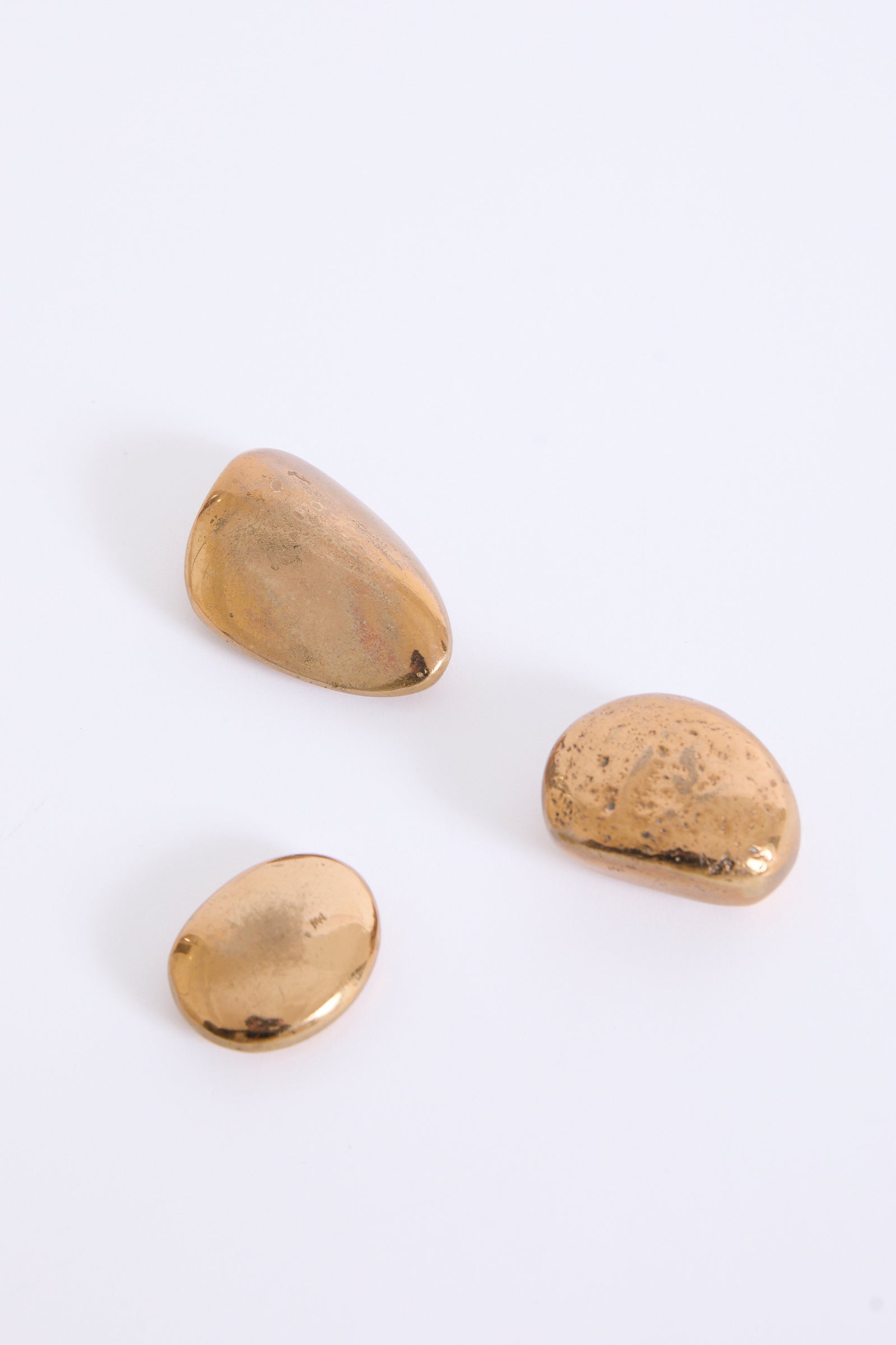 10463- Three Bronze Pebbles by Monique Gerber