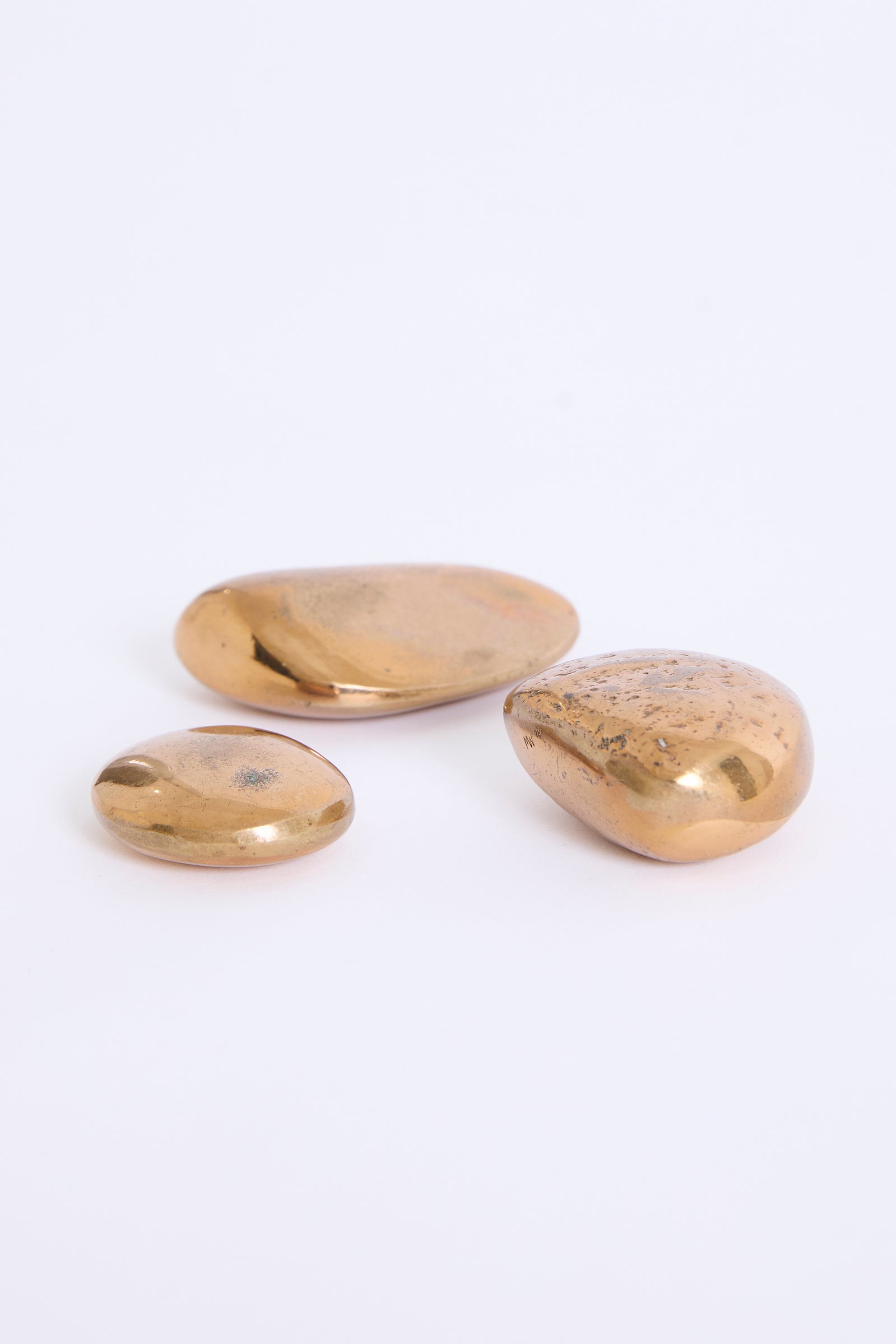 Three Bronze Pebbles by Monique Gerber