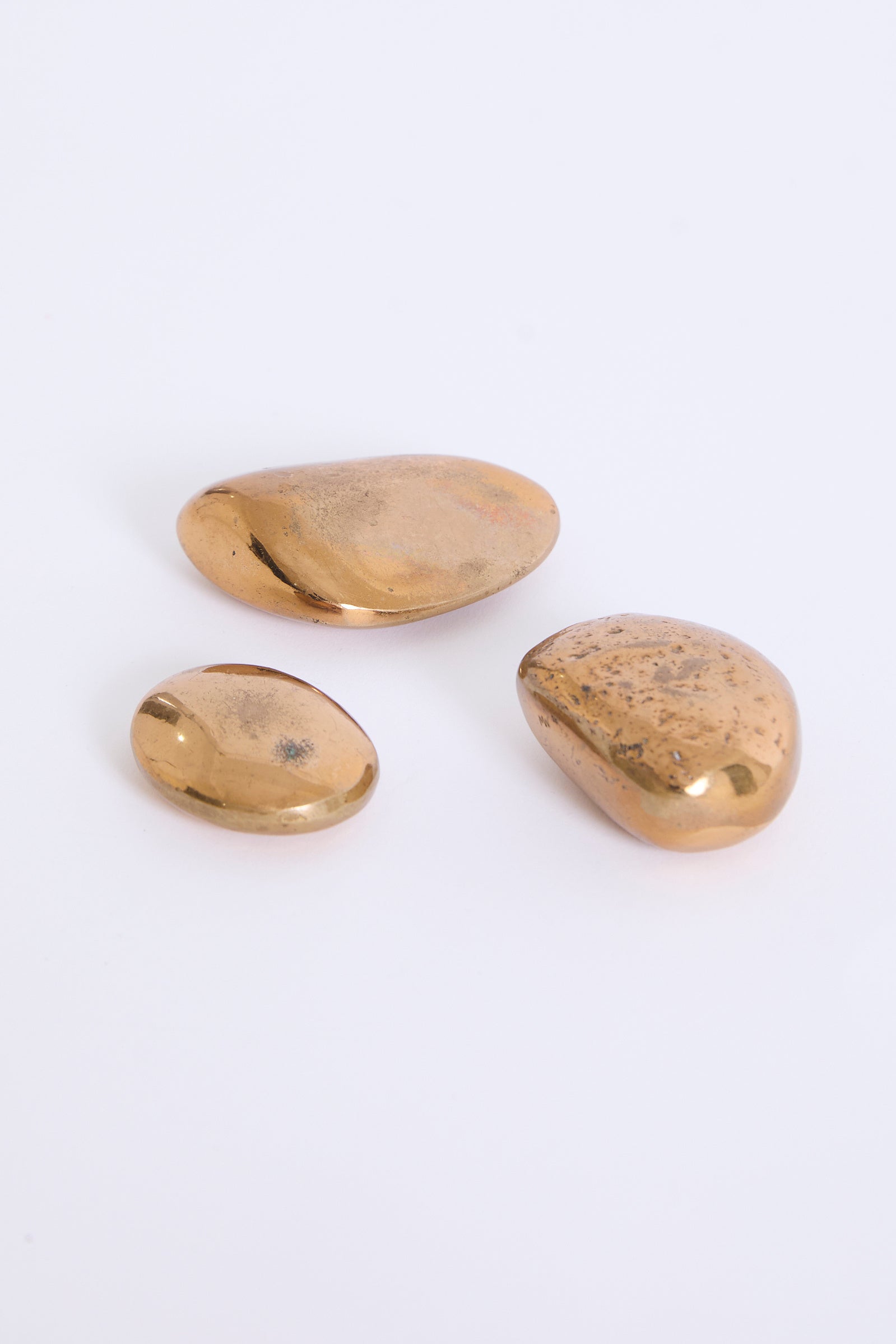 Three Bronze Pebbles by Monique Gerber