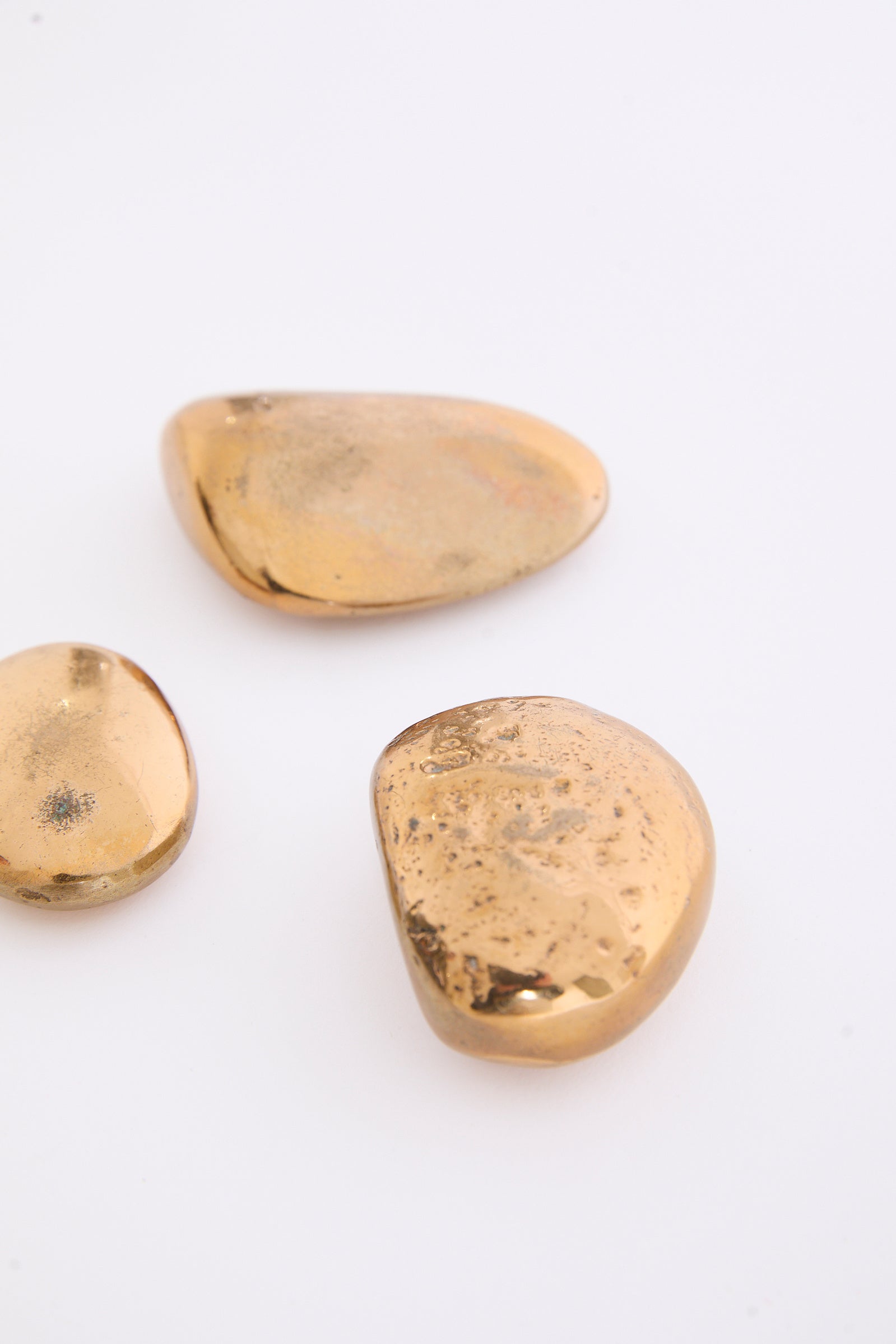 Three Bronze Pebbles by Monique Gerber