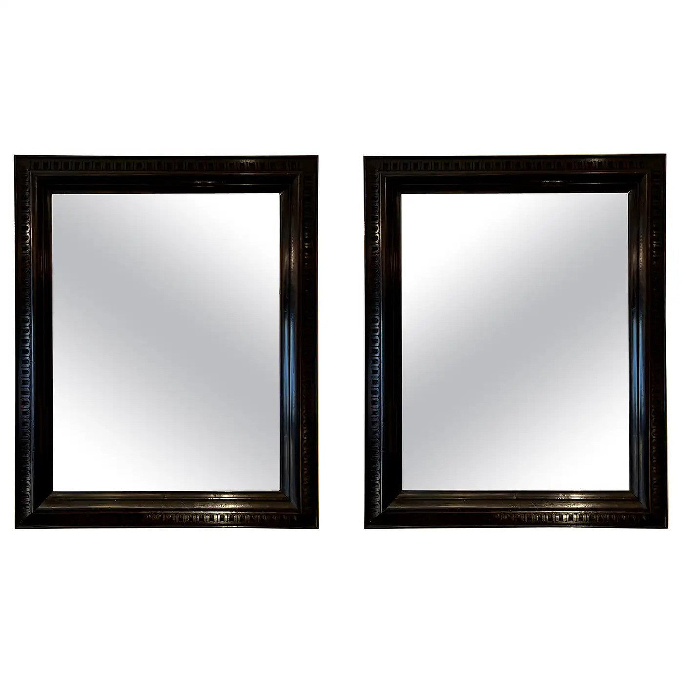 9352- Pair of Ebonised Carved Wood Mirrors