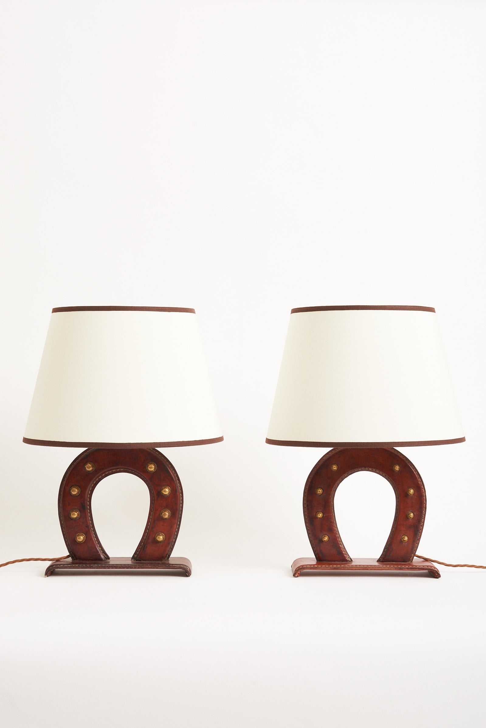7074- Pair of Leather Table Lamps by Jacques Adnet (1900-1984)