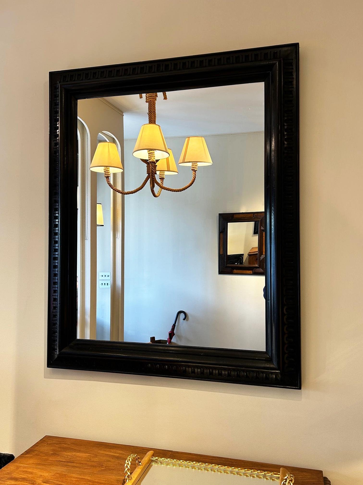 Pair of Ebonised Carved Wood Mirrors