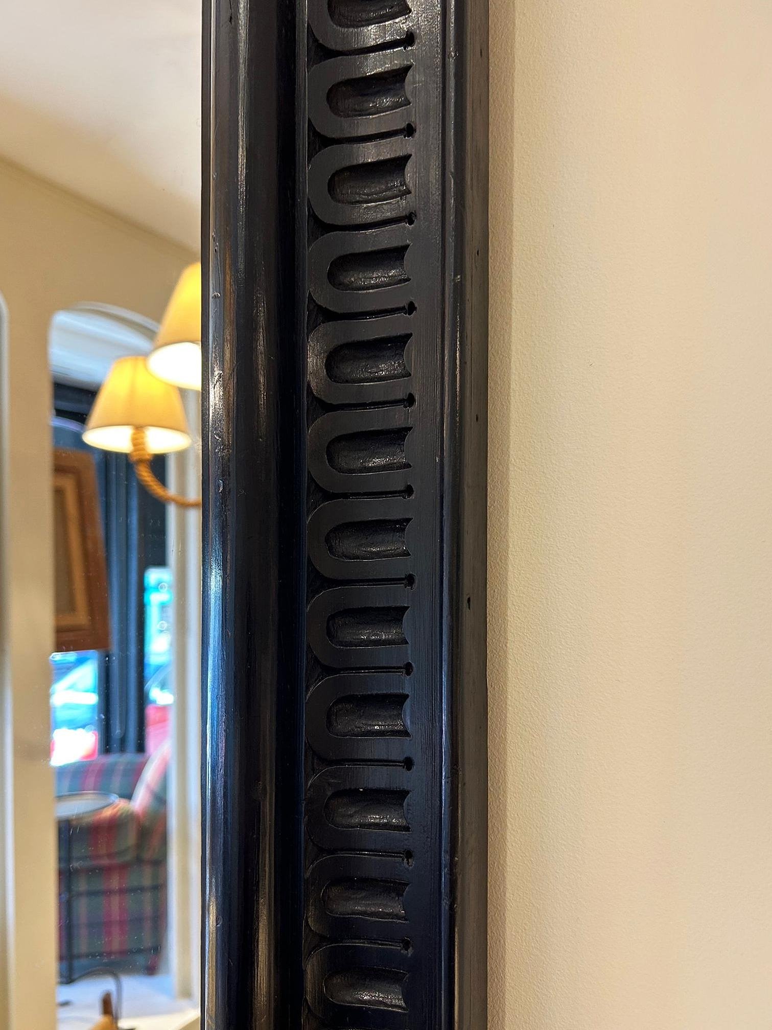 Pair of Ebonised Carved Wood Mirrors