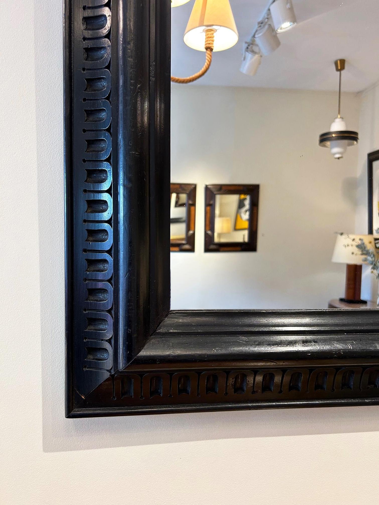 Pair of Ebonised Carved Wood Mirrors