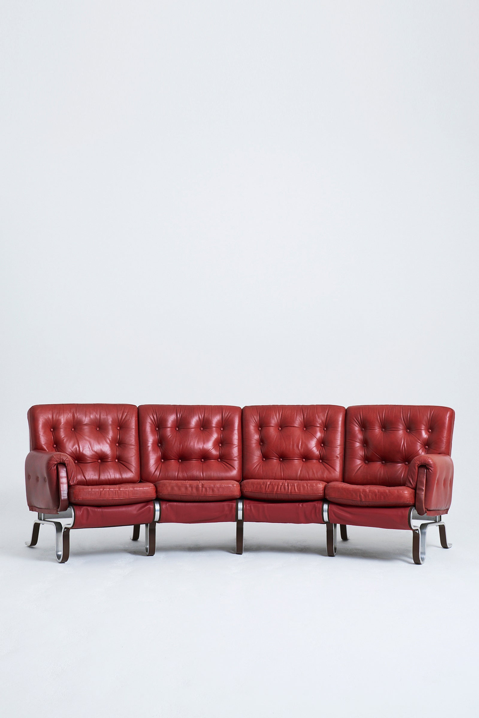 9539- Red Leather Curved Sofa by Eric Sigfrid Persson