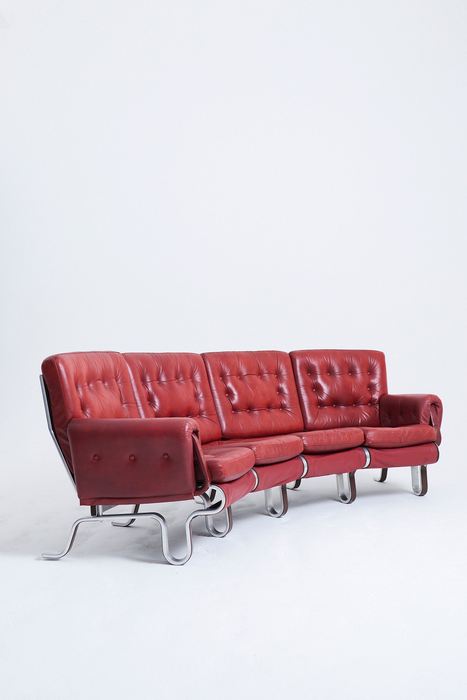 Red Leather Curved Sofa by Eric Sigfrid Persson